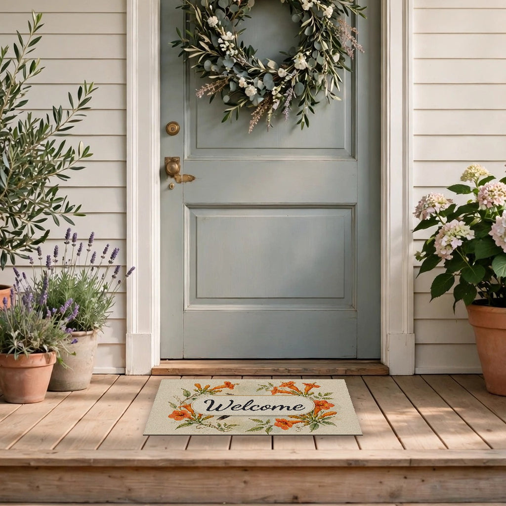 Hummingbird and Trumpet Flowers Welcome Doormat at a front door