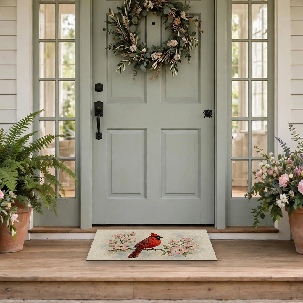 Cardinal on a Spring Branch Doormat at a front door