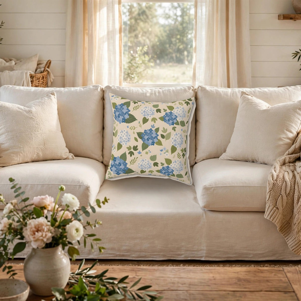 Hydrangea Blue Floral Pattern Throw Pillow – Style 2 on a cozy sofa