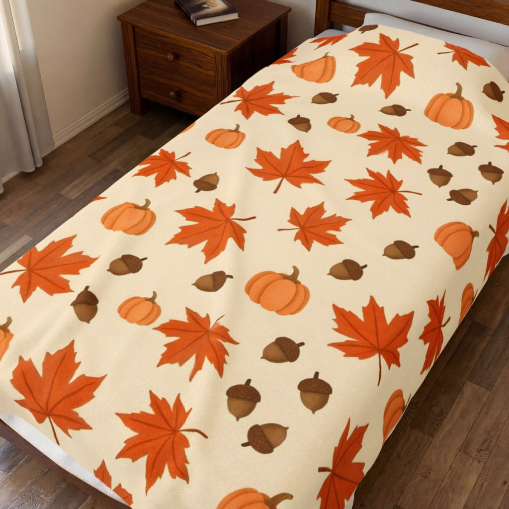 Autumn Leaves and Pumpkins Pattern Velveteen Plush Blanket – Style 2 spread on a bed