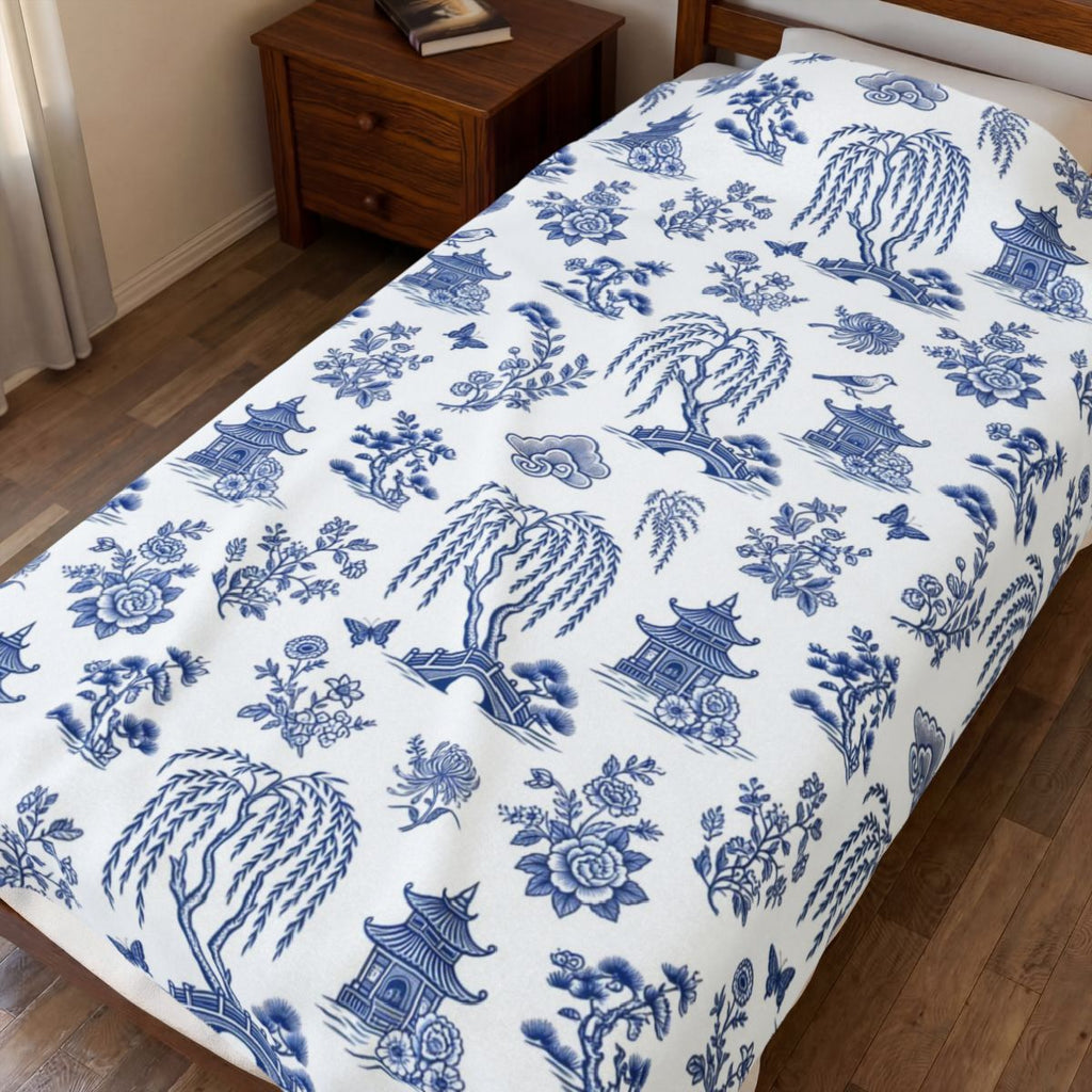 Blue Willow China Pattern Velveteen Plush Blanket – Style 2 spread on a bed