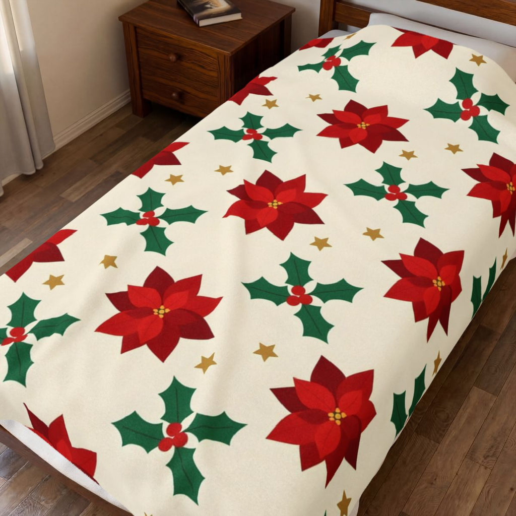 Christmas Poinsettia Pattern Velveteen Plush Blanket spread on a bed