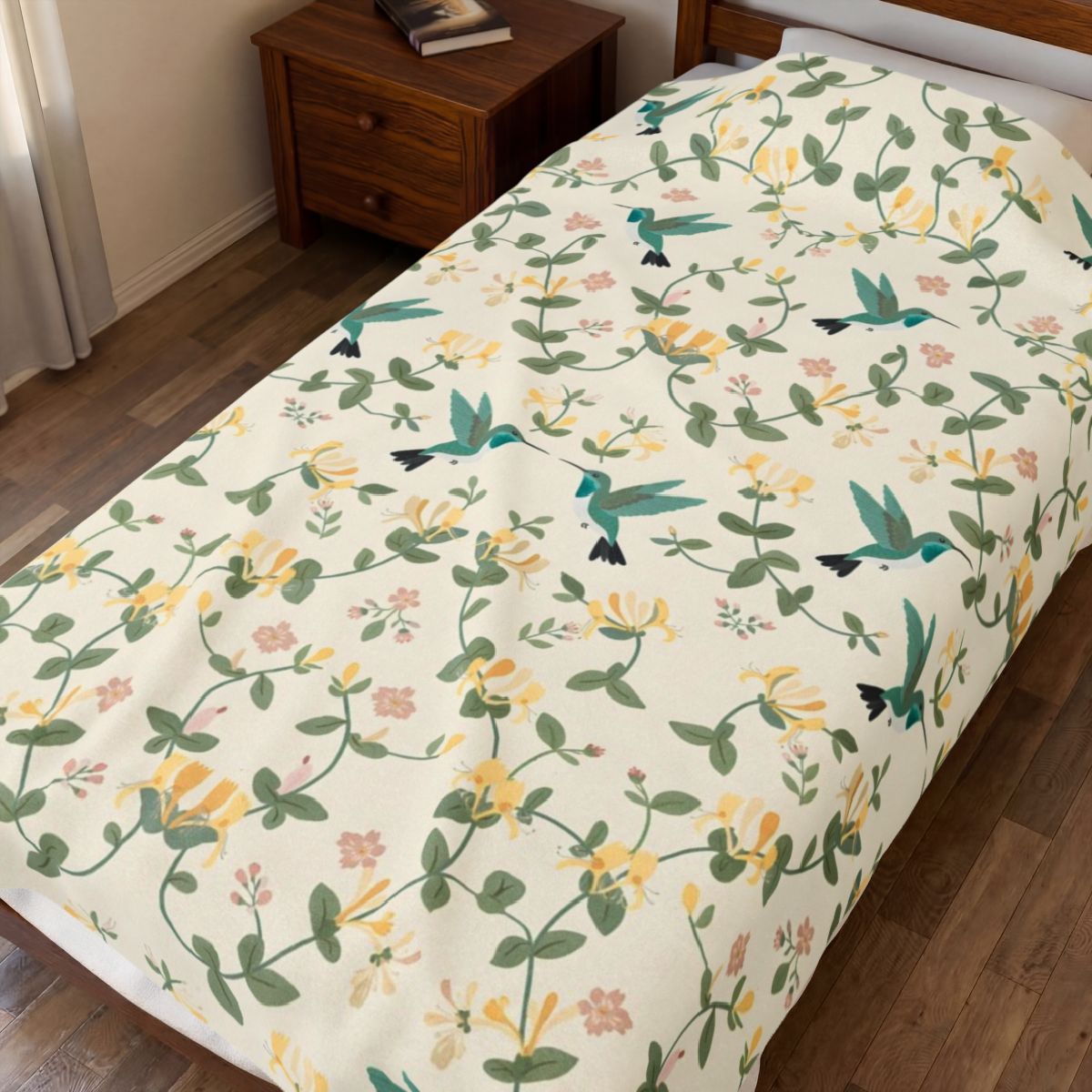 Hummingbirds and Honeysuckle Pattern Velveteen Plush Blanket spread on a bed